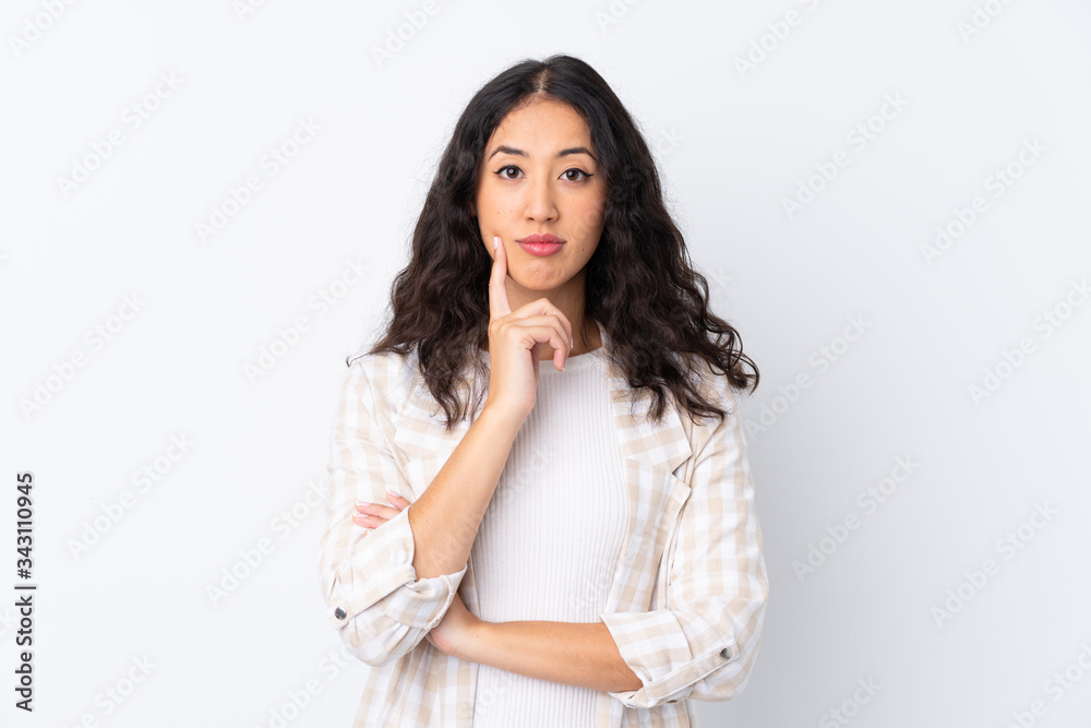 Mixed race woman over isolated white background Looking front Mixed race woman over isolated white background Looking front