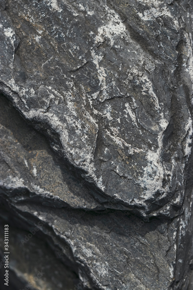 Texture of raw stone, marble in natural light. Rough natural background.