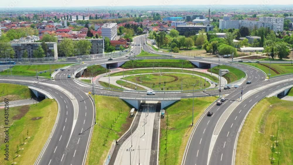 Zagreb, Croatia, new roundabout in Remetinec neighborhood, city traffic road with vehicles driving, aerial drone footage Zagreb, Croatia, new roundabout in Remetinec neighborhood, city traffic road with vehicles driving, aerial drone footage