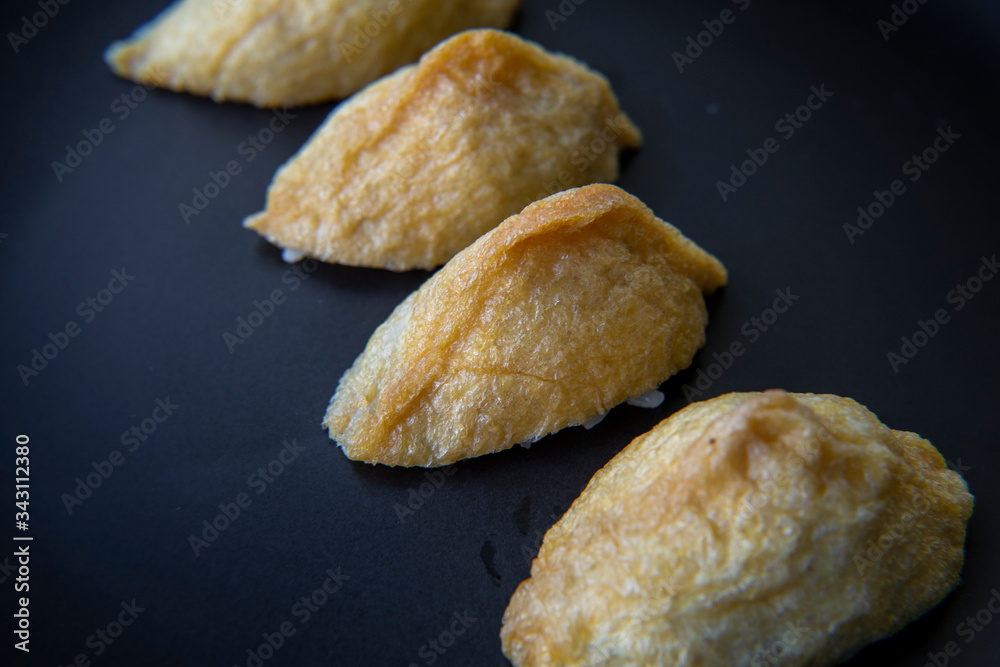 Korean style inari sushi which is fried tofu stuffed with rice Korean style inari sushi which is fried tofu stuffed with rice