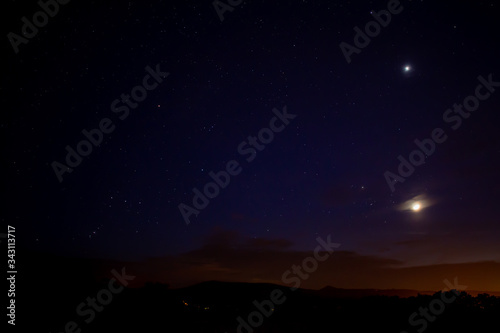 the moon and sirius in the night sky