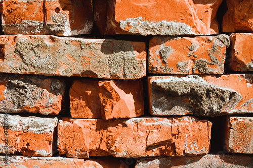 Brick wall. Old uneven brick.House construction. Texture and background.