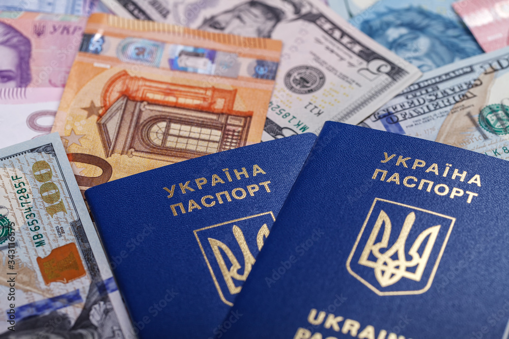 Fototapeta premium Ukrainian passport and currency of different countries necessary for travel and trips abroad.