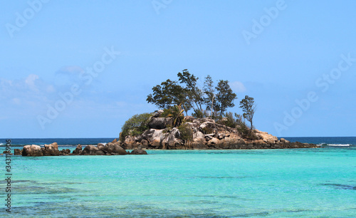 Tropical Island with turquoise water surrounding it