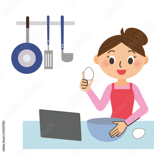 レシピ動画を見ながら料理をする母