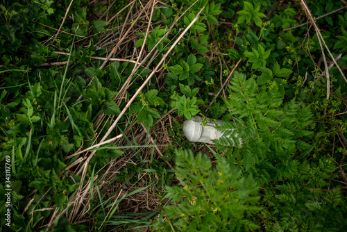 Plastic bottle on grass pollution