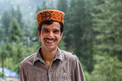 portrait of a man from himachal pradesh, India with traditional himachali cap