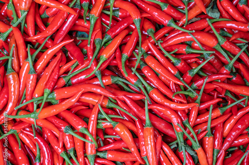 Red hot chili peppers for sale at street food market in Vietnam. Close up
