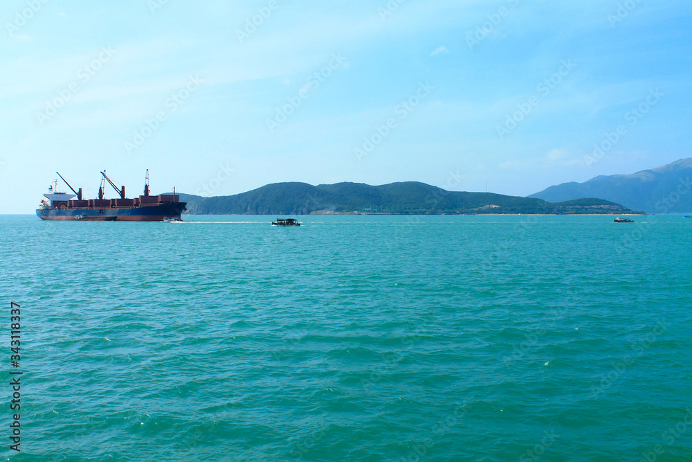 A scenic view of the mountain islands and boats near the city of Nha Trang. Turquoise Sea in Vietnam A scenic view of the mountain islands and boats near the city of Nha Trang. Turquoise Sea in Vietnam