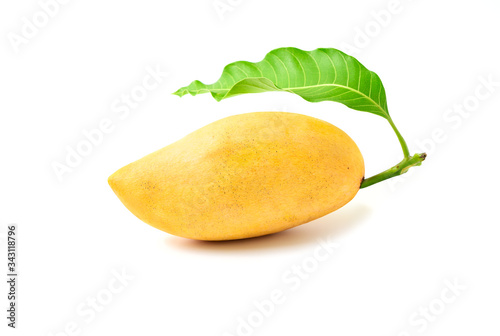 Delicious ripe yellow mango with green leaf isolated on white