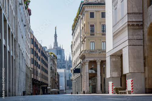 Fototapeta Naklejka Na Ścianę i Meble -  Empty streets due to covid-19 virus. Lockdown in european town. Strange spring in Milan corso Vittorio Emanuele Italy. Report from the deserted cities, people are locked up. Nobody can go out