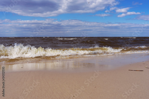 Waves on beach on Kyiv Sea, spring