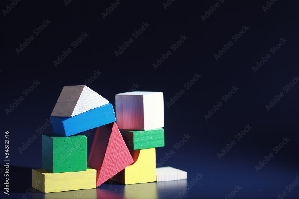 Obraz premium Children's development. Children's wooden toy on the table in the play area. Room of children's creativity and self-development. Wooden constructor.