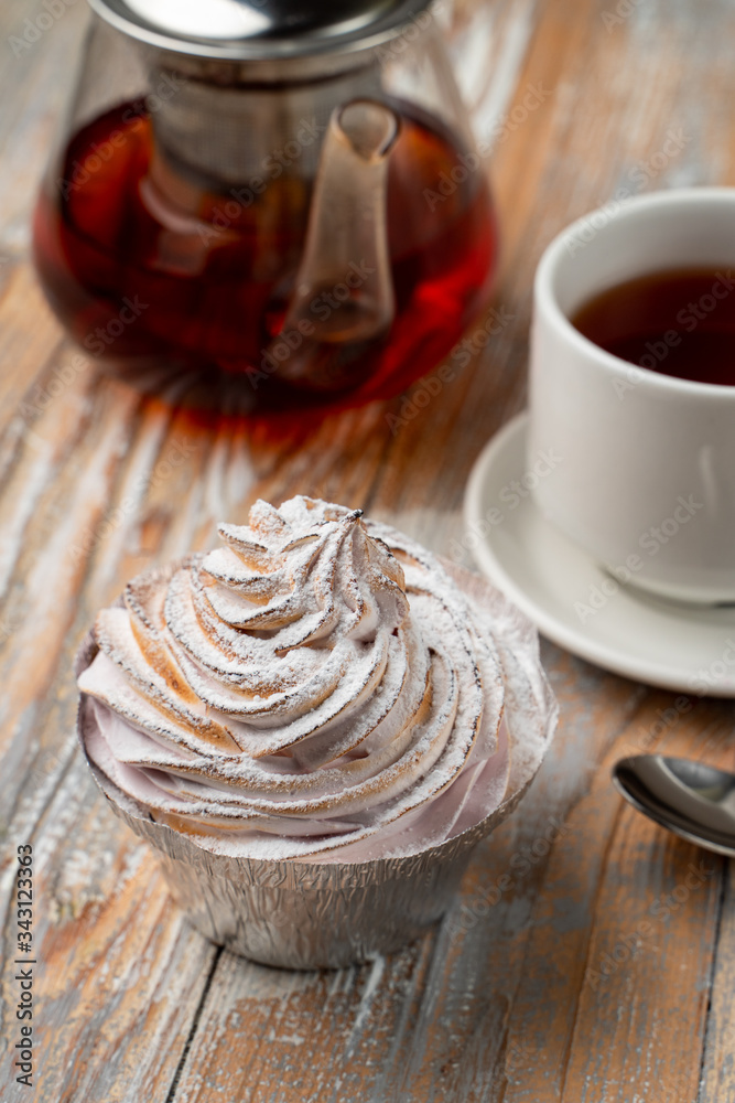 Homemade berry tartlet with whipped burnt crud, served with black tea