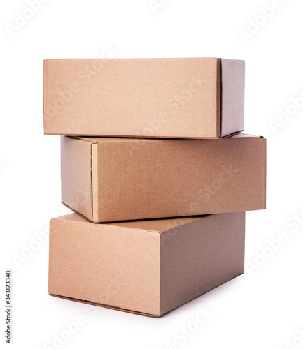 Heap of cardboard boxes isolated on white background. Carton delivery packaging, recycling brown boxes
