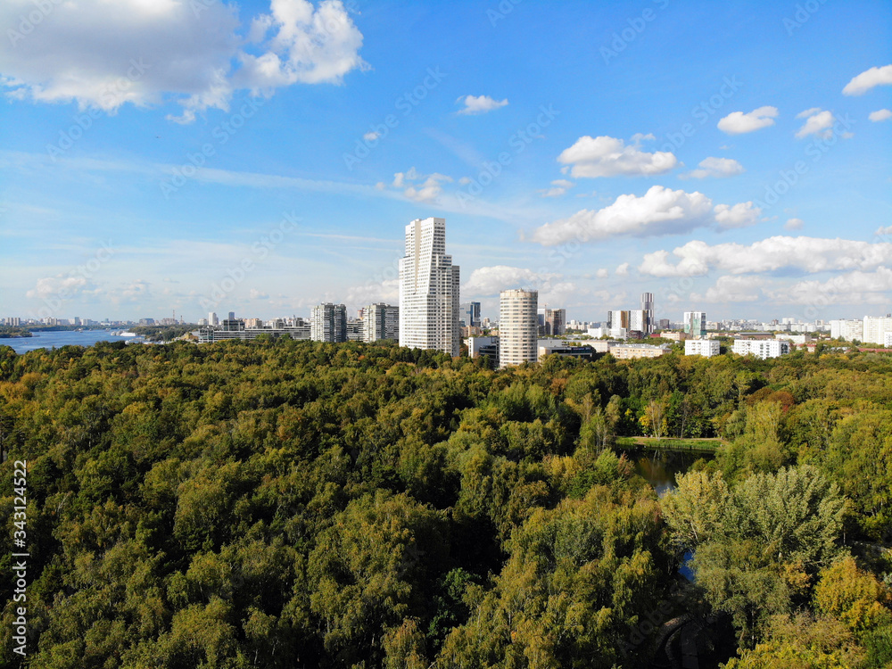 View of Moscow from a height, Park and high residential buildings on the horizon.