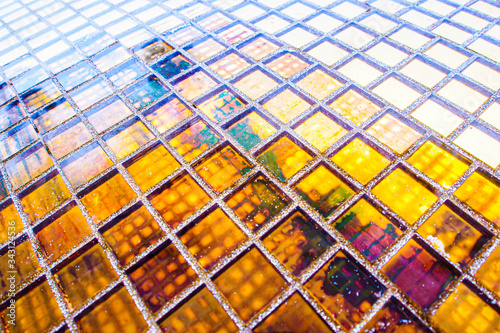 Abstract golden yellow square mosaic tiles for textured backgrounds. Beautiful repeat patterns.