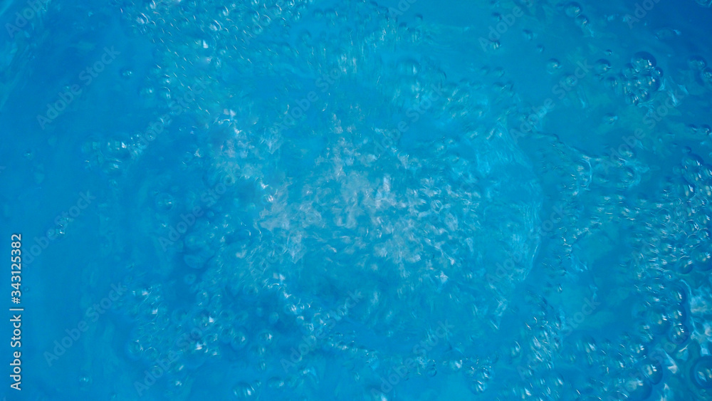 Abstract wallpaper with water surface with bubbles on blue background.