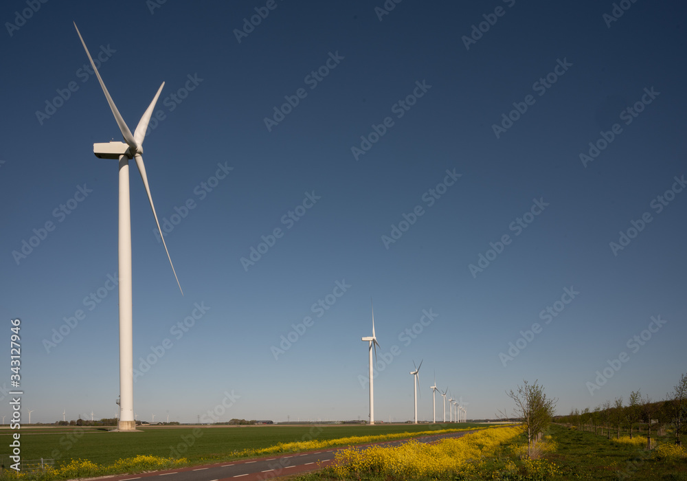 Windturbines in sunny spring landscape Windturbines in sunny spring landscape