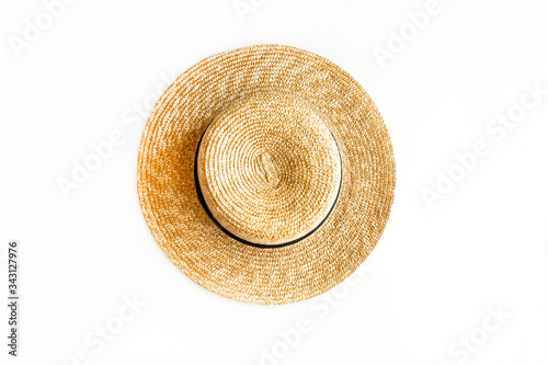 Quadro em tela Flat lay of straw hat isolated on white background. Top view