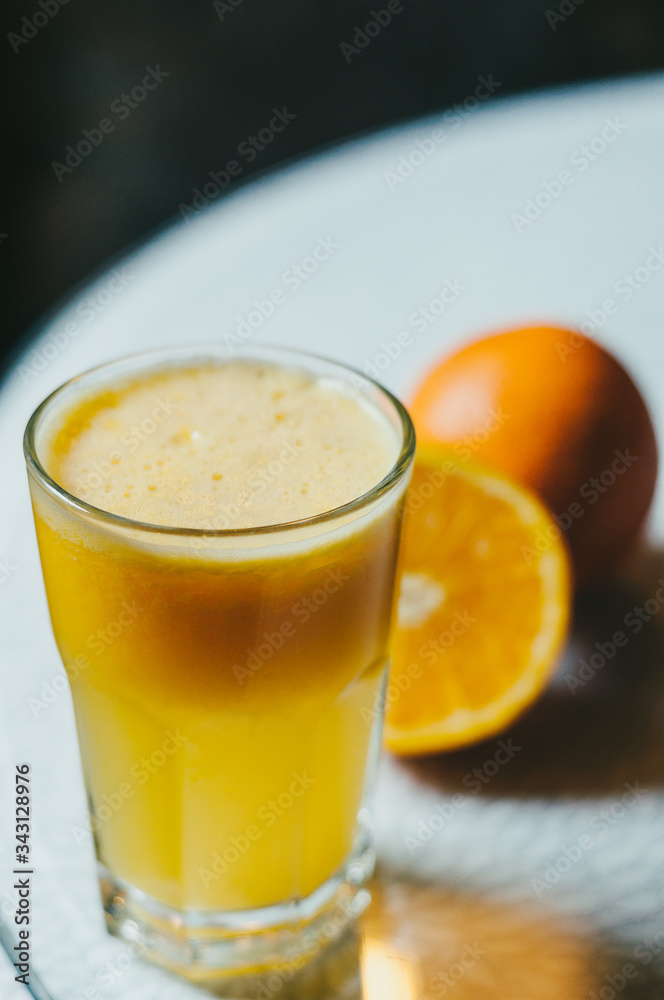 Orange juice and slices of orange fruit in glass Orange juice and slices of orange fruit in glass