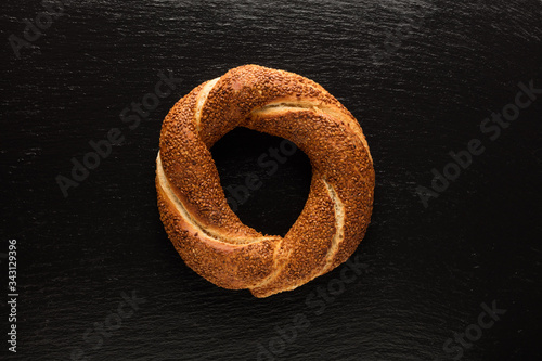 Turkish bagel on black background (simit)