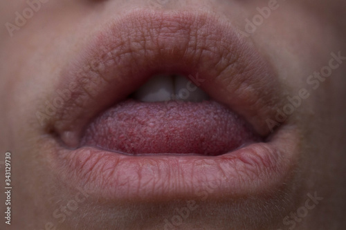 macro photo of the lips and a tongue