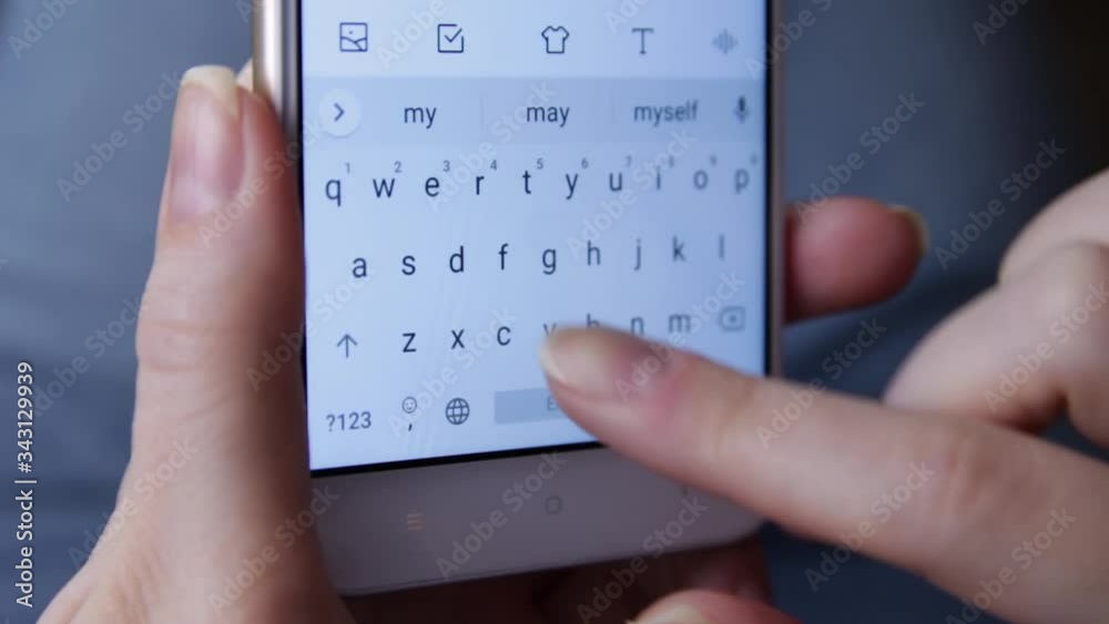Woman writes a message smartphone. Female texting with mobile telephone at home, typing text message on cell phone. Close up. Concept