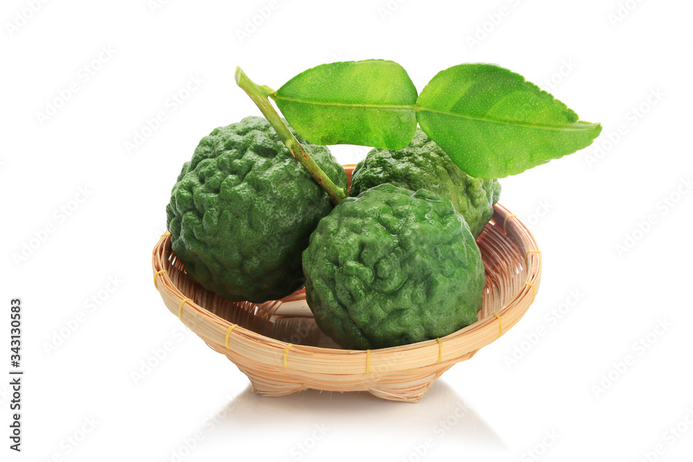 Obraz premium Bergamot in basket material of Essential Oils isolated on white background with clipping path.