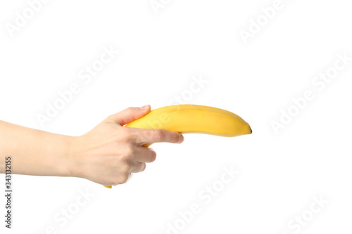 Female hand holds banana, isolated on white background