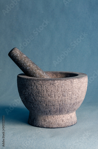 Gray stone mortar with pestle.