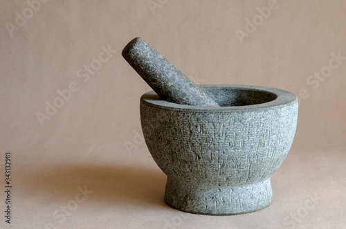 Fotografía Gray stone mortar with pestle.