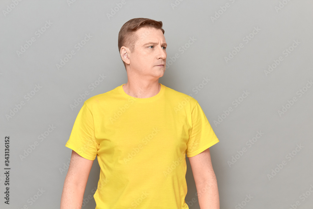 Portrait of mature man with neutral calm expression on face Portrait of mature man with neutral calm expression on face