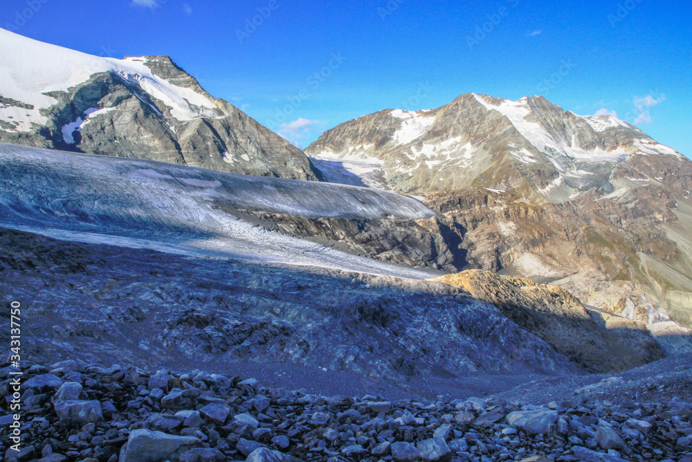 Obraz premium High alpine landscape at the swiss alps in the early morning as seen from the top of Barrhorn mountain at Canton Wallis in Switzerland