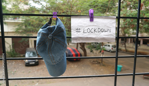 Lockdown sign on a window of building as a referral to the Coronavirus pandemic in the India. 