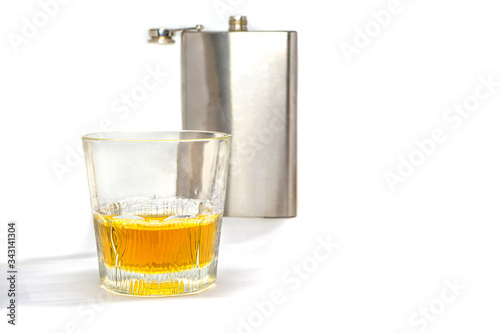 flask and glass tumbler isolated on a white