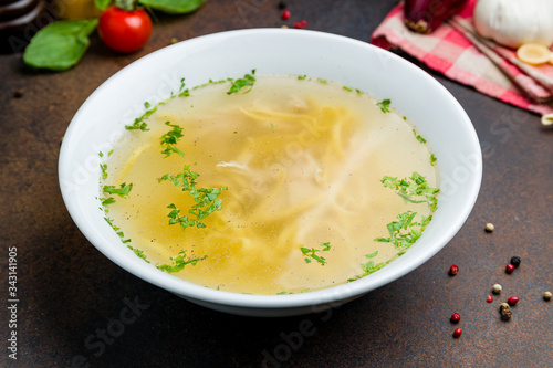 Chicken soup bouillon in a plate