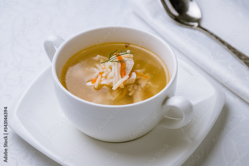 Chicken soup bouillon in a plate Chicken soup bouillon in a plate
