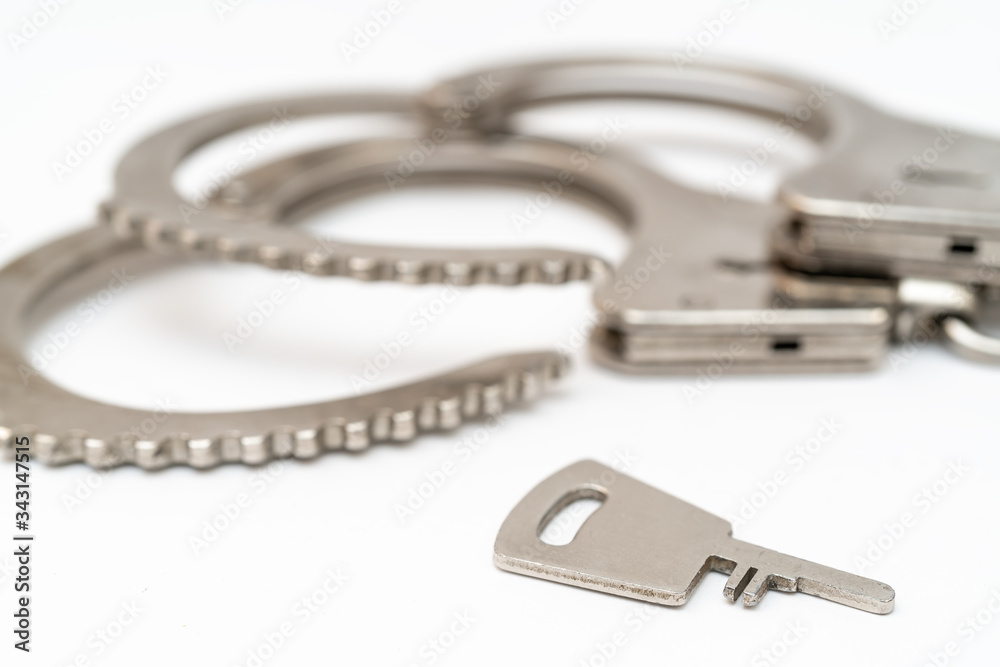 Metal handcuffs. Detention of criminals breaking law. Restriction of freedom. Metal handcuffs. Detention of criminals breaking law. Restriction of freedom.