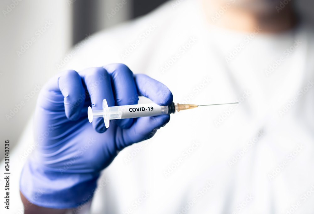 Doctor with coronavirus vaccine needle. Covid 19 shot concept. Virus immunity research in lab. Nurse wearing gloves in hospital. Injection equipment and cure for corona pandemic. NCOV syringe. Doctor with coronavirus vaccine needle. Covid 19 shot concept. Virus immunity research in lab. Nurse wearing gloves in hospital. Injection equipment and cure for corona pandemic. NCOV syringe.