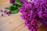 bunch of lilac flowers on wooden table