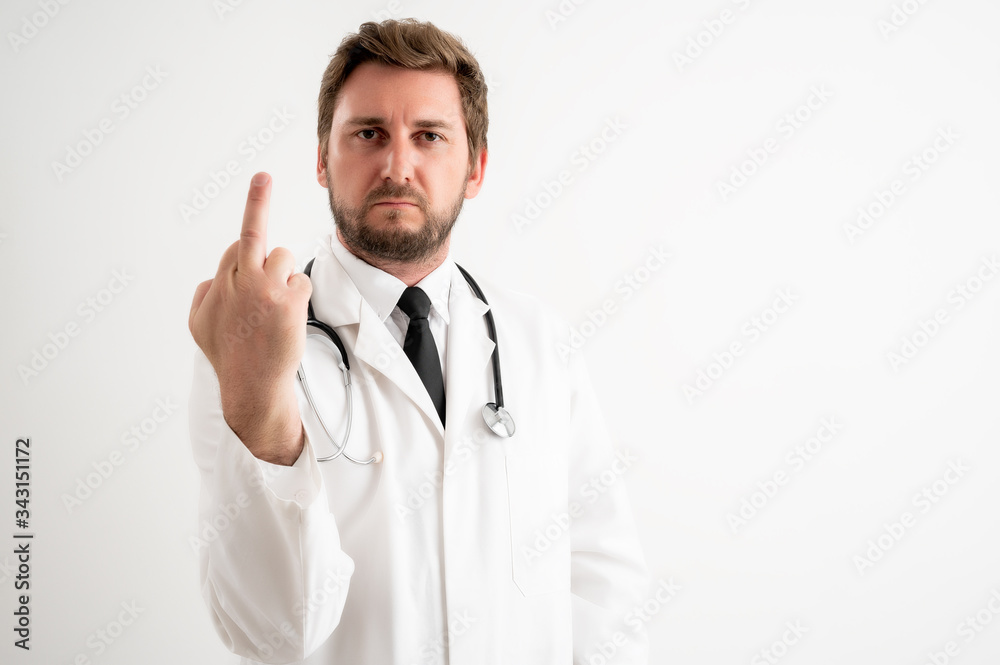 Male doctor with stethoscope in medical uniform showing fuck you Male doctor with stethoscope in medical uniform showing fuck you