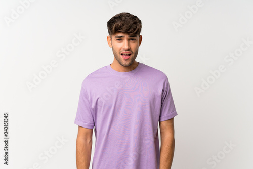 Young handsome man over isolated white background with surprise facial expression