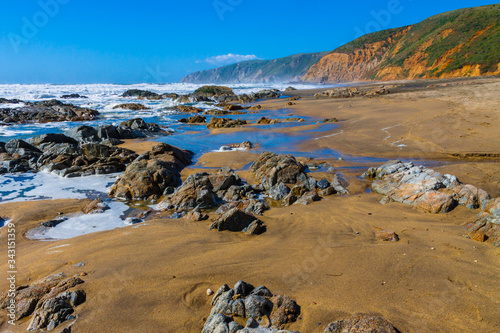 Rock Covered McClures Beach With Tomales Point in The Distance, Point Reyes National Sea Shore, California, USA photo