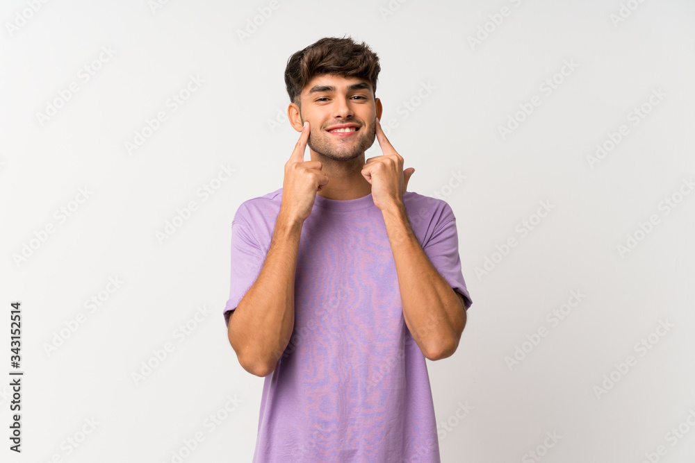 Young handsome man over isolated white background smiling with a happy and pleasant expression Young handsome man over isolated white background smiling with a happy and pleasant expression