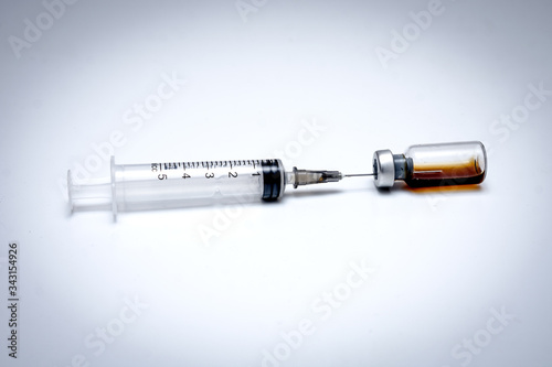 Vaccine in a vial with a syringe