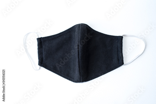 A black cloth mask in a white scene