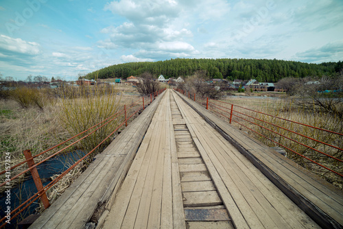 Old wooden bridge over the river