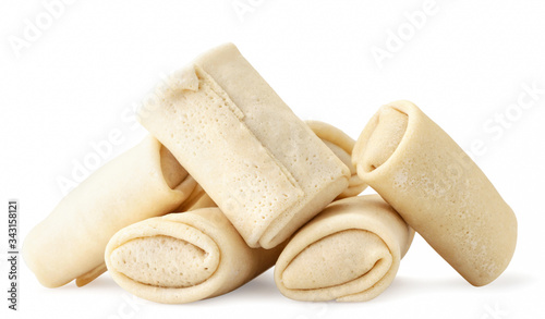 Semi-finished pancakes with filling a slide on a white background. Isolated