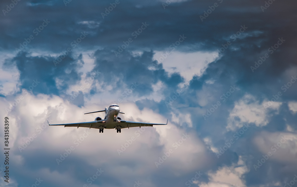 Business jet in the cloudy sky Business jet in the cloudy sky
